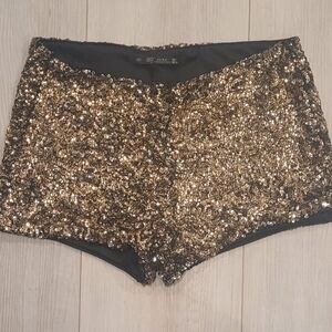 Worn once. Zara lined black and gold sequin shorts.